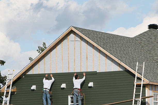 Professional Storm Damage Siding Repair technician working in Wharton, TX